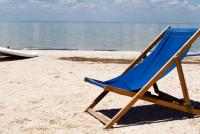 a chair sitting on the beach